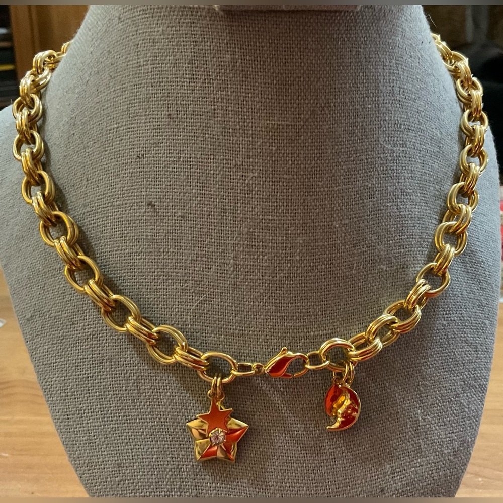 Kirk’s Folly: gold toned double oval link necklace with star and moon charms.